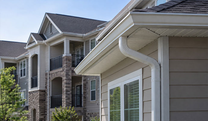 Apartment building with installed gutter system