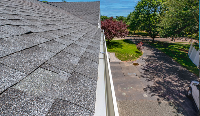 Clean gutter installed along an roof line
