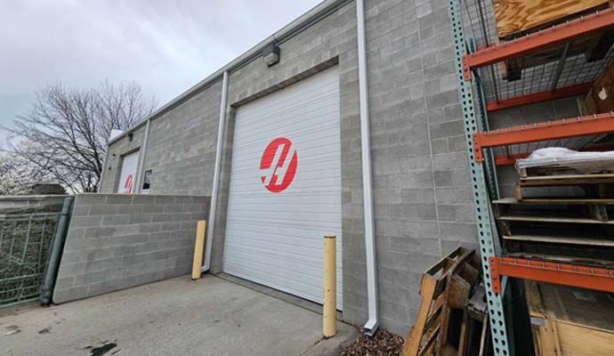 Industrial warehouse exterior downspout system