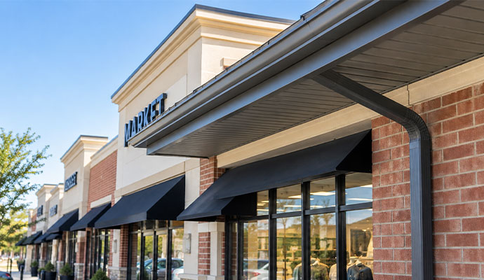 Retail store front with installed gutter system
