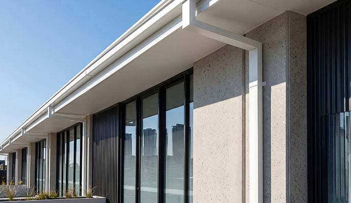 Gutter and downspout installed in a  commercial building