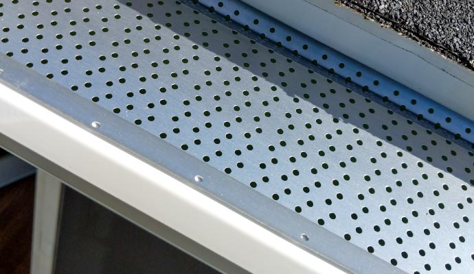 Perforated metal gutter guard