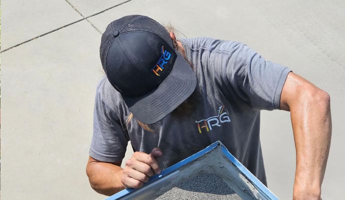 Professional worker repairing gutter leak
