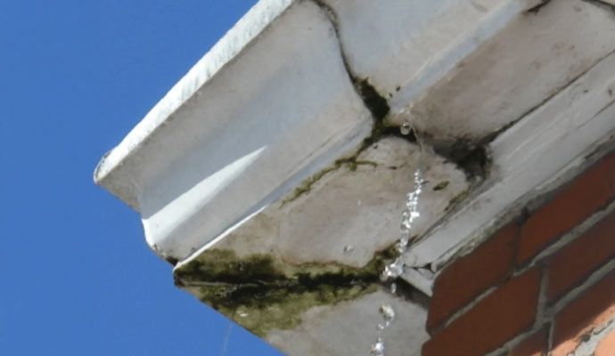 Damaged gutter leaking water