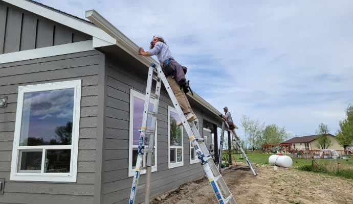 Person installing lifetime gutter